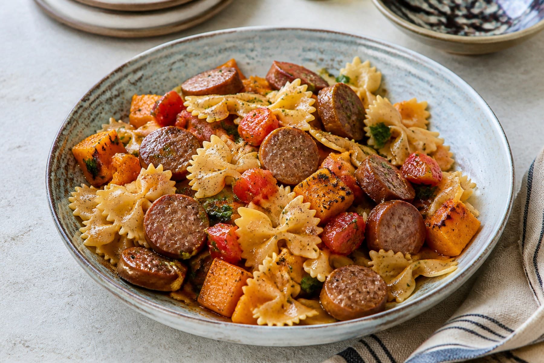 Farfalle with browned boerewors roast butternut tomato and parsley