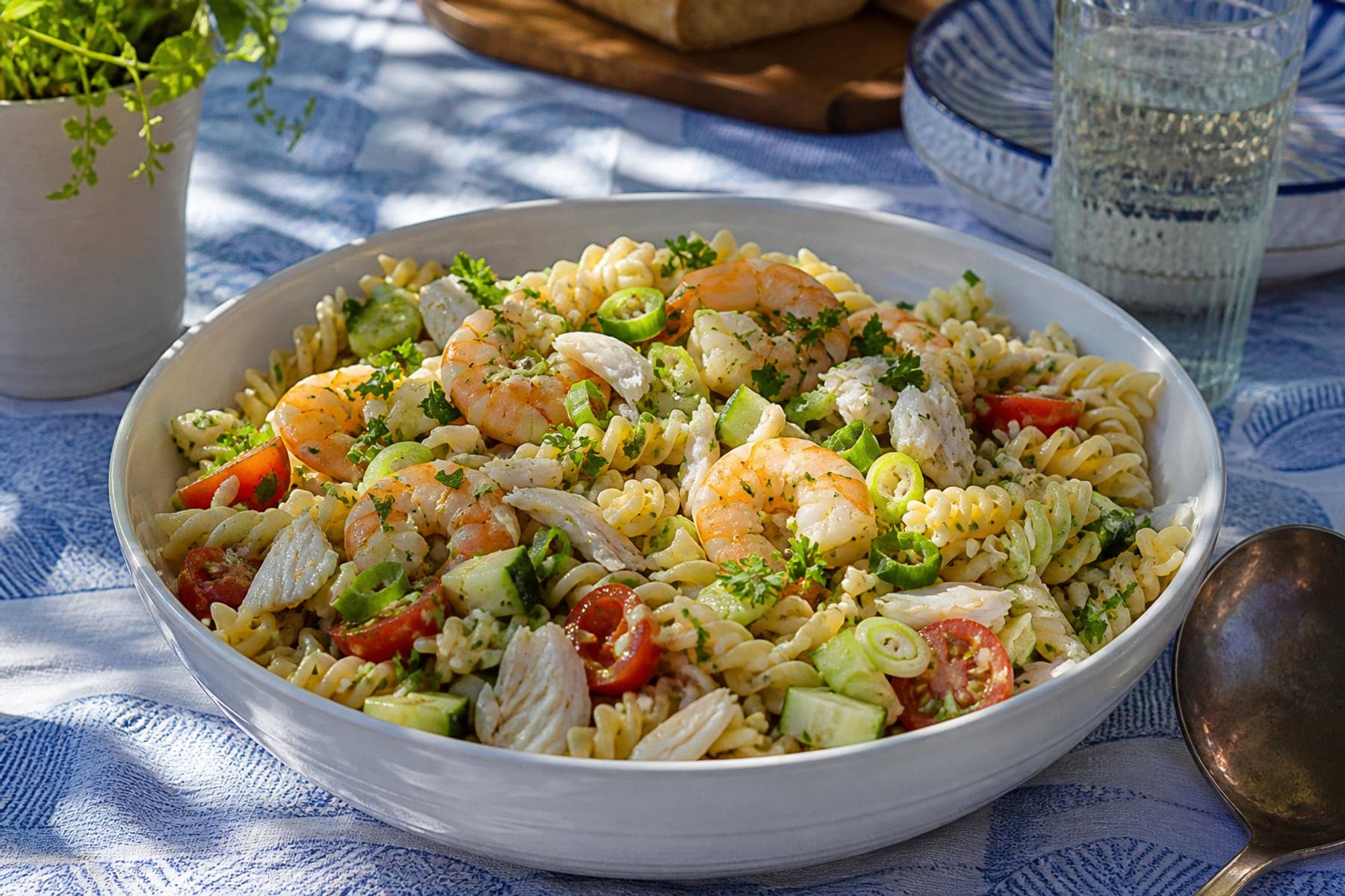 Fusilli seafood pasta salad with prawns white fish cucumber tomatoes and herbs